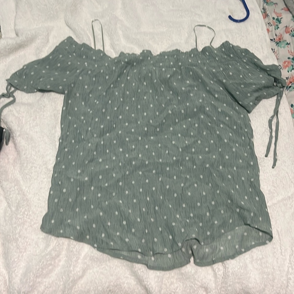 I am selling a green poke a dot off the shoulder shirt